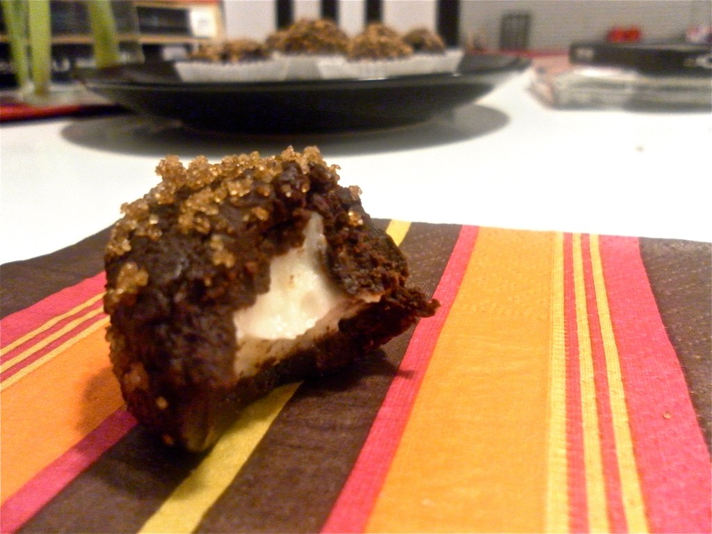 Brown sugar coated chocolate truffle with orange-cream cheese center