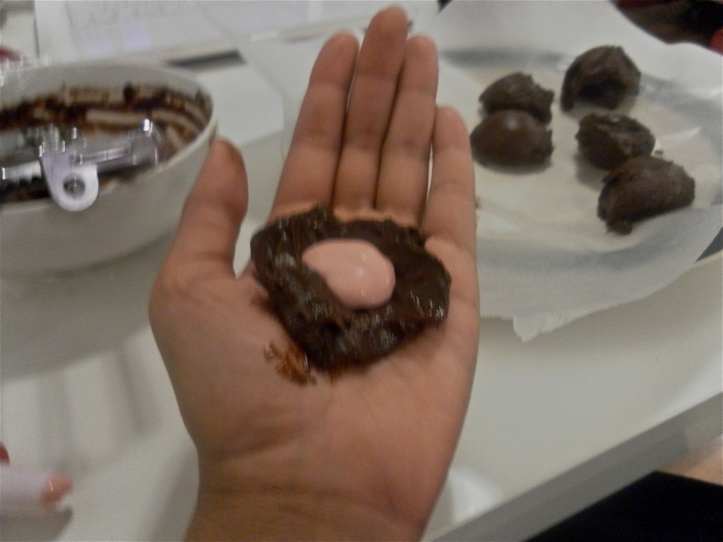 Shaping strawberry cream cheese truffles